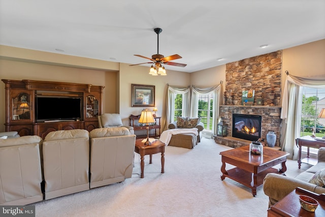 158 Mccormick Dr, Port Deposit, MD 21904 - carpeted living area featuring a fireplace, plenty of natural light, and ceiling fan
