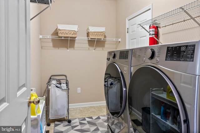 158 Mccormick Dr, Port Deposit, MD 21904 - laundry room with washer and clothes dryer and baseboards