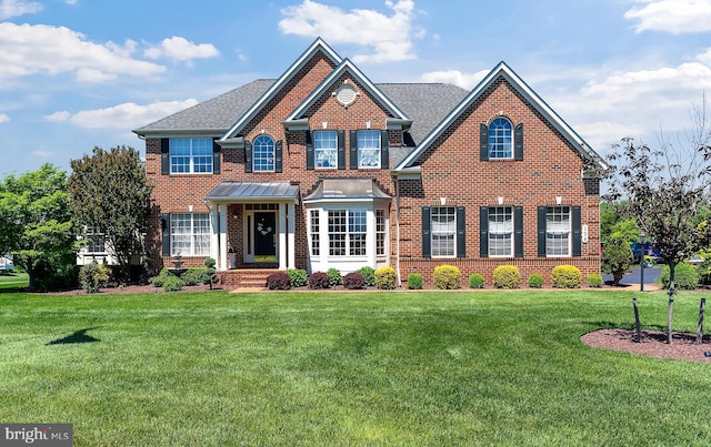 158 Mccormick Dr, Port Deposit, MD 21904 - colonial home with brick siding, a front lawn, and roof with shingles