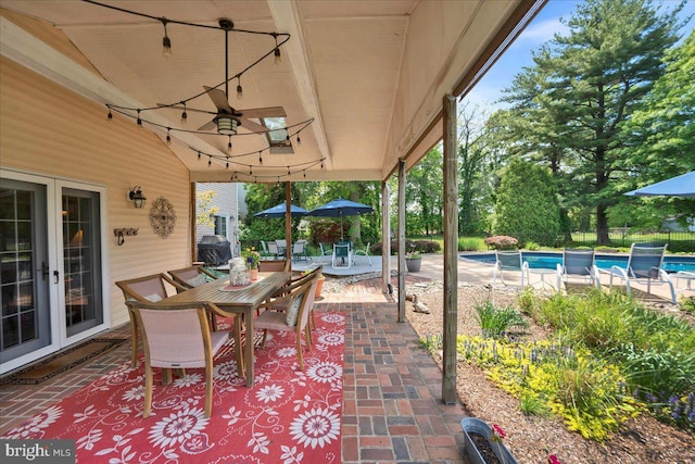 view of patio featuring outdoor dining area and french doors