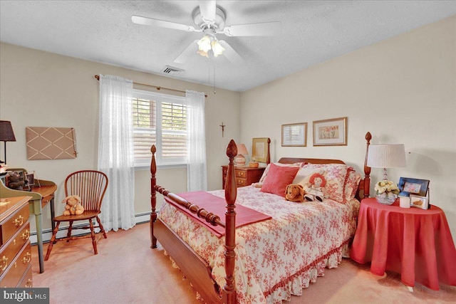 bedroom featuring carpet floors, a textured ceiling, ceiling fan, and baseboard heating