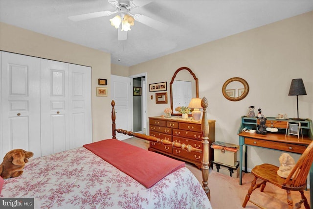 bedroom with carpet, a closet, and a ceiling fan
