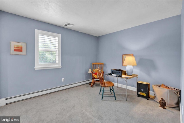 home office with baseboard heating, carpet flooring, and baseboards