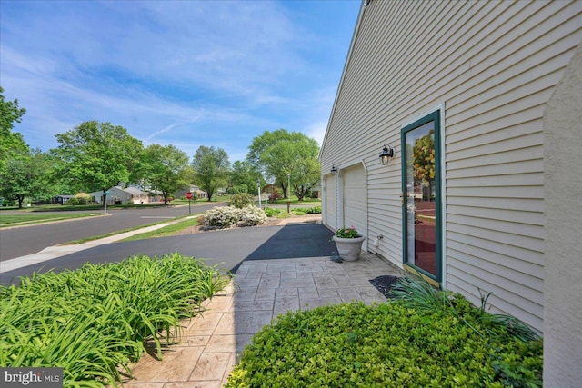 view of side of property featuring a garage