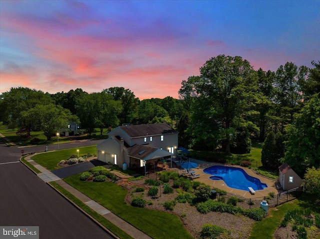 aerial view of property and surrounding area with a pool