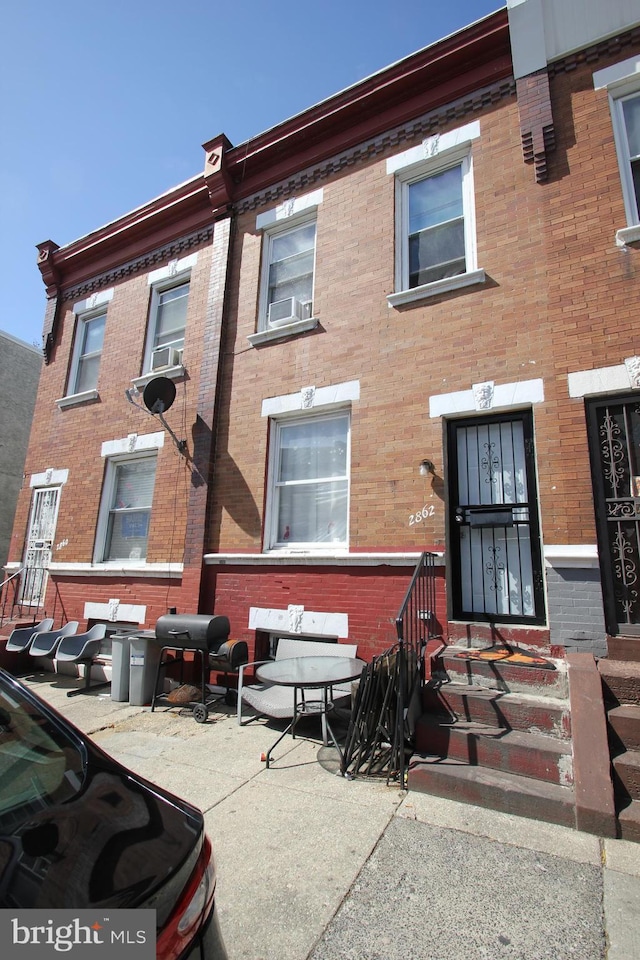 view of front of home featuring brick siding