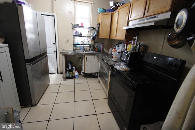 kitchen featuring under cabinet range hood, light tile patterned floors, black appliances, and dark countertops