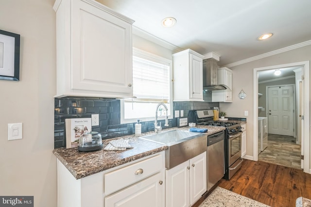 398 Grande Blvd, Rio Grande, NJ 08242 - kitchen with a sink, white cabinets, decorative backsplash, and stainless steel appliances