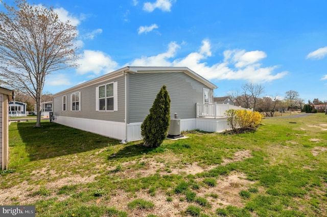 398 Grande Blvd, Rio Grande, NJ 08242 - view of property exterior with central AC and a lawn