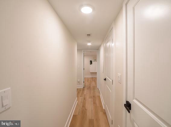 2001 S Norwood St, Philadelphia, PA 19145 - hall featuring light wood-style floors, baseboards, and visible vents