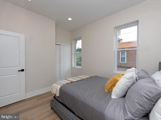 2001 S Norwood St, Philadelphia, PA 19145 - bedroom with light wood-style flooring, baseboards, multiple windows, and recessed lighting