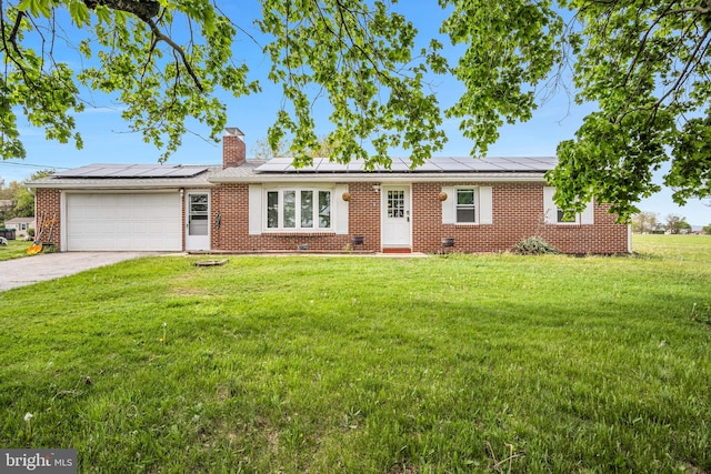 ranch-style house featuring concrete driveway, brick siding, a front yard, and a garage