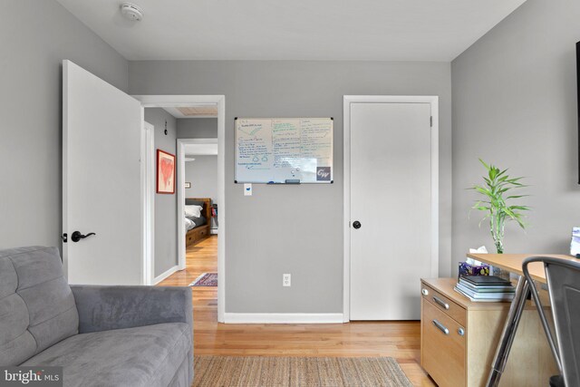 office space featuring light wood finished floors and baseboards