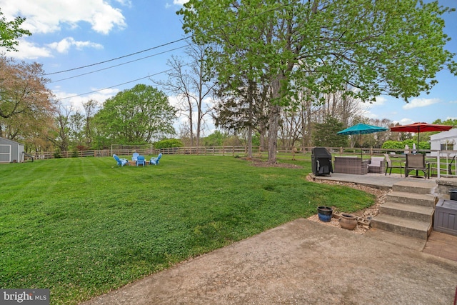 view of yard with fence and a patio