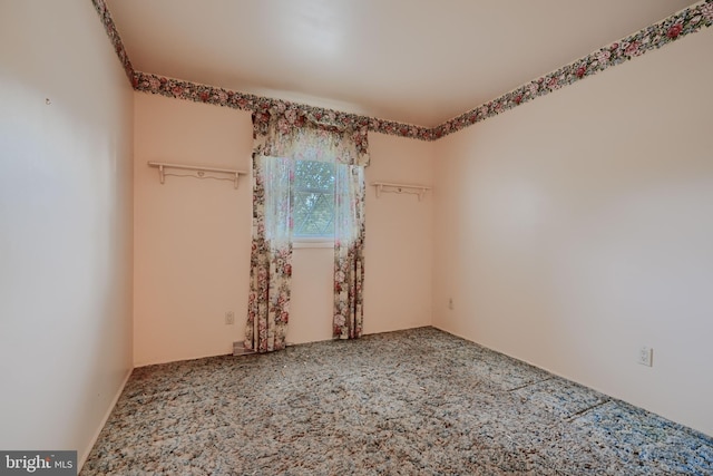unfurnished room with carpet