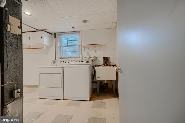 washroom featuring light floors, washer and clothes dryer, and laundry area