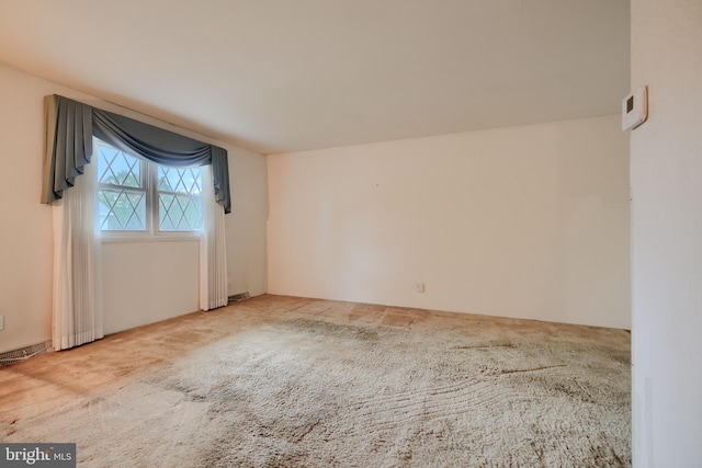 unfurnished room with carpet floors