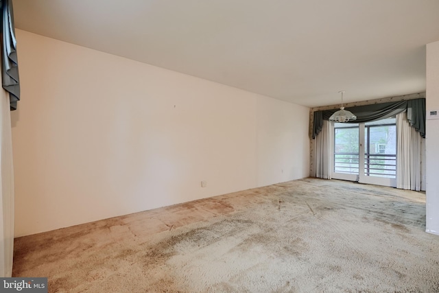 spare room featuring carpet