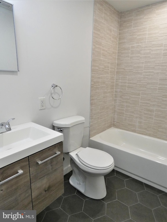 2147 W Grange Ave, Philadelphia, PA 19138 - full bathroom with washtub / shower combination, toilet, tile patterned flooring, and vanity