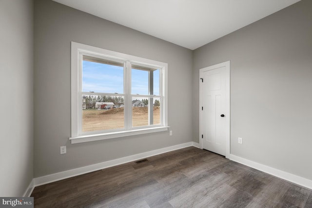 309 Gun Club Rd, Stephenson, VA 22656 - empty room with visible vents, baseboards, and dark wood-style floors