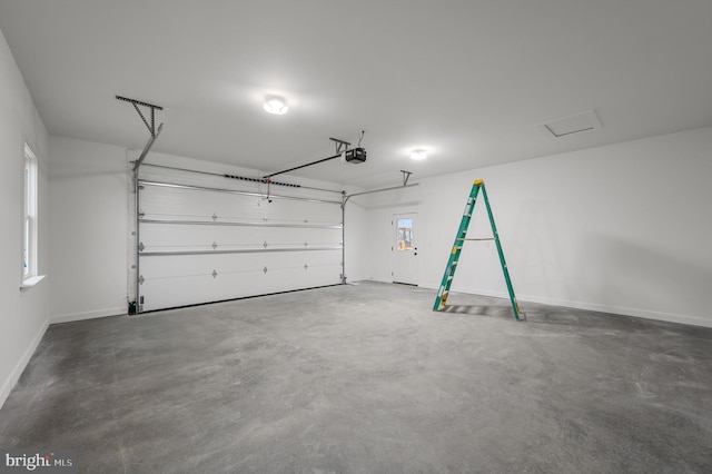 309 Gun Club Rd, Stephenson, VA 22656 - garage with baseboards and a garage door opener