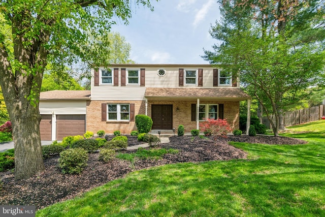 view of front of home with brick siding, fence, an attached garage, a front yard, and a porch