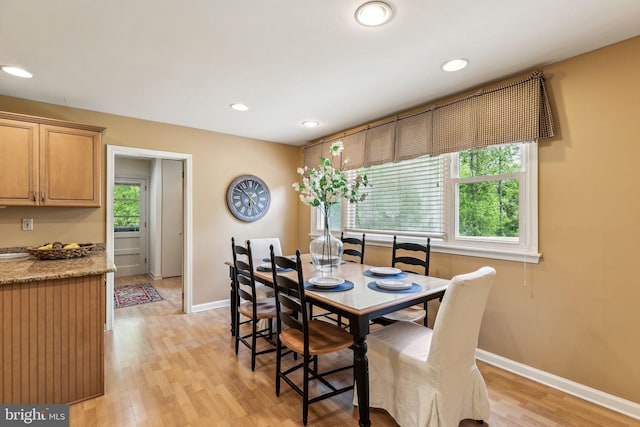 dining area featuring baseboards, recessed lighting, and light wood-type flooring