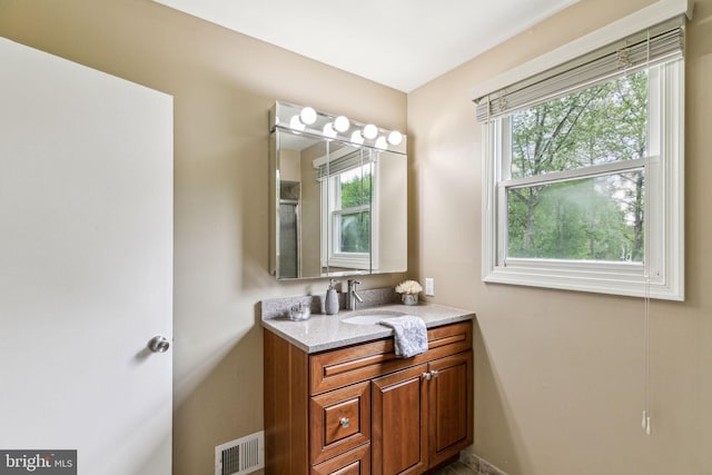 bathroom with vanity and visible vents