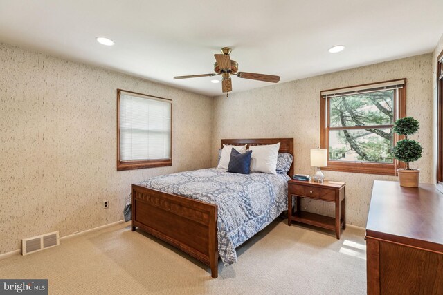 carpeted bedroom with baseboards, recessed lighting, ceiling fan, and visible vents