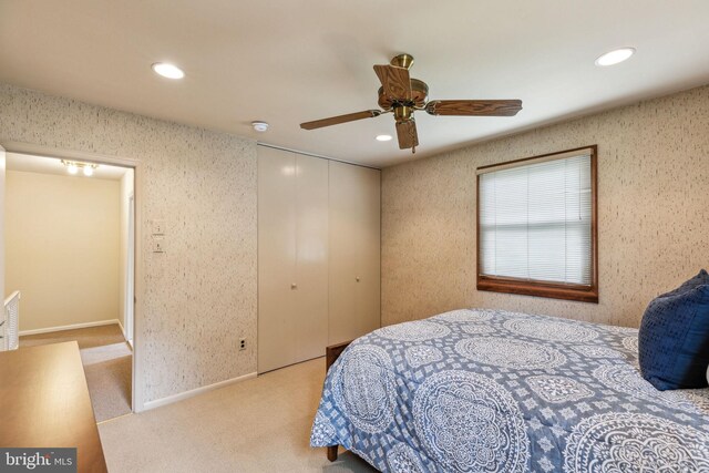 bedroom with carpet flooring, a closet, and recessed lighting