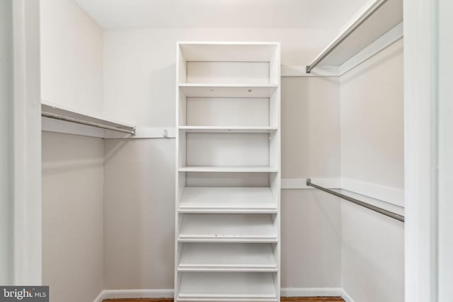 spacious closet with wood finished floors