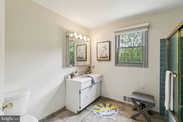 bathroom with toilet, tile patterned flooring, vanity, and visible vents