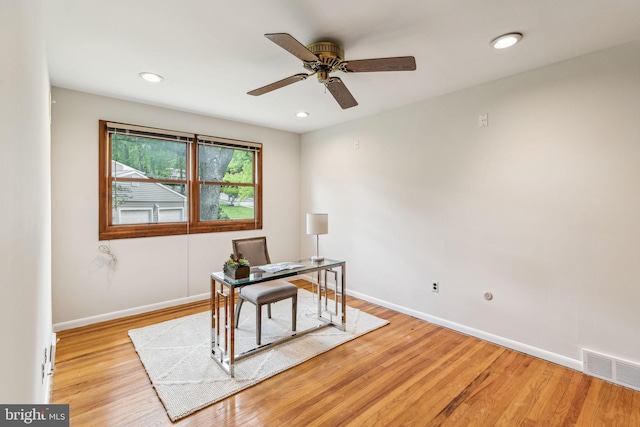 home office with a ceiling fan, recessed lighting, baseboards, visible vents, and wood finished floors