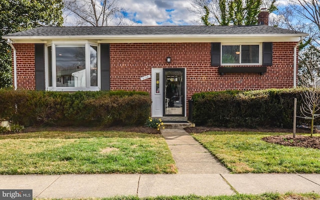 5104 Oakglen Dr, Rockville, MD 20852 - view of front of house with brick siding, a chimney, and a front yard