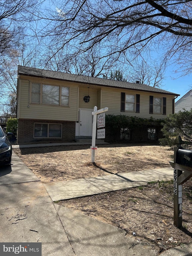 4913 Odell Rd, Beltsville, MD 20705 - split foyer home with concrete driveway and brick siding