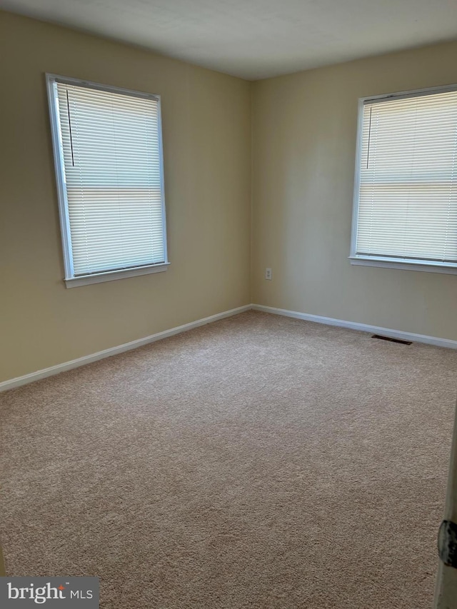 4913 Odell Rd, Beltsville, MD 20705 - unfurnished room featuring visible vents, baseboards, and carpet flooring