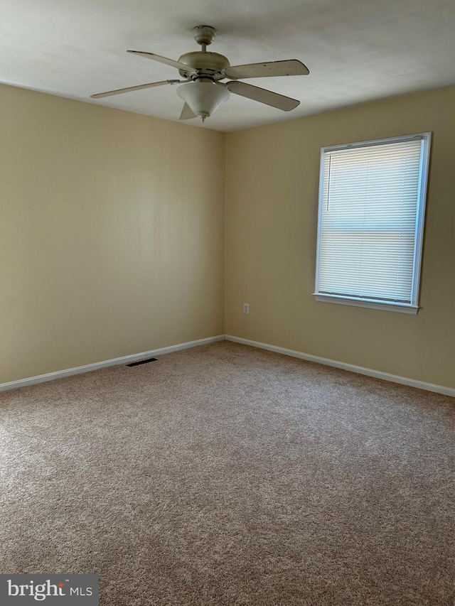 4913 Odell Rd, Beltsville, MD 20705 - carpeted empty room featuring visible vents, baseboards, and a ceiling fan