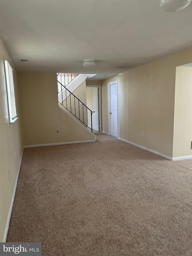 4913 Odell Rd, Beltsville, MD 20705 - spare room featuring stairs, carpet flooring, and baseboards