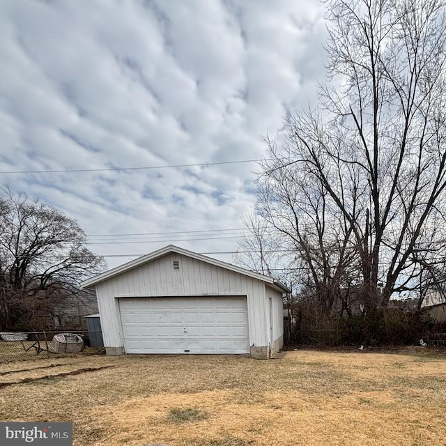 detached garage with fence