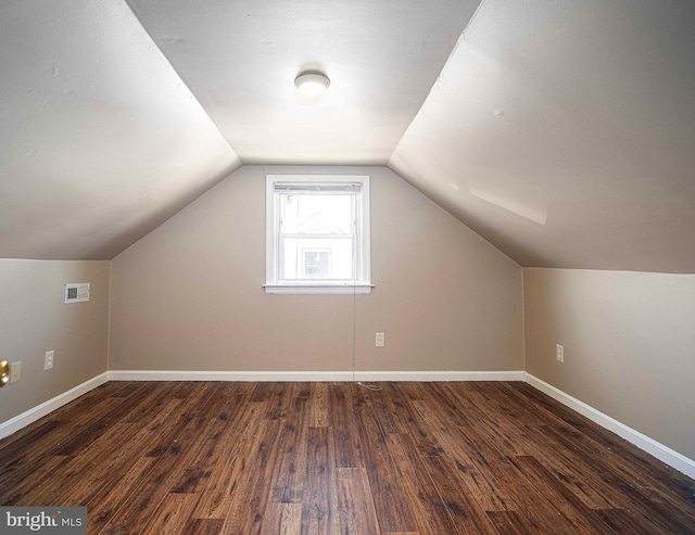 bonus room featuring wood finished floors, baseboards, and visible vents