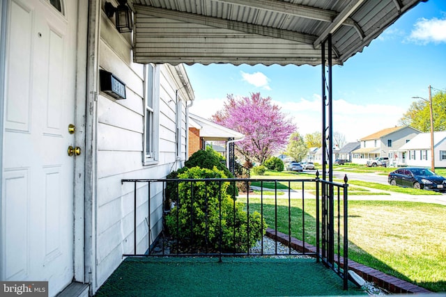 exterior space featuring a porch and a residential view