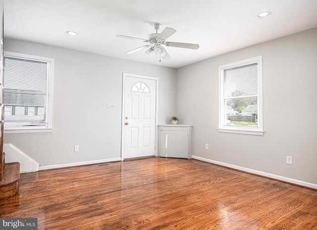 foyer entrance featuring wood finished floors, ceiling fan, baseboards, and recessed lighting