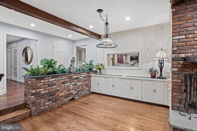 21 Robin Rd, Moorestown, NJ 08057 - kitchen with light wood-style floors, white cabinets, recessed lighting, pendant lighting, and light countertops