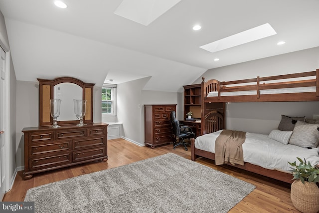 21 Robin Rd, Moorestown, NJ 08057 - bedroom with a skylight, vaulted ceiling, light wood-style floors, a desk, and baseboards