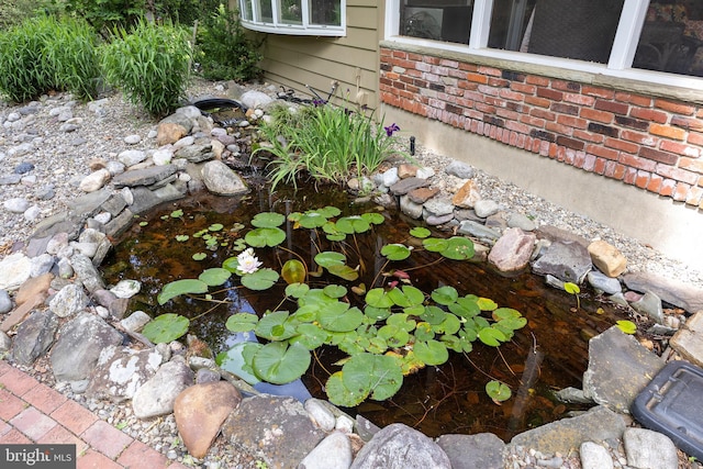 21 Robin Rd, Moorestown, NJ 08057 - exterior view of a garden pond and brick siding