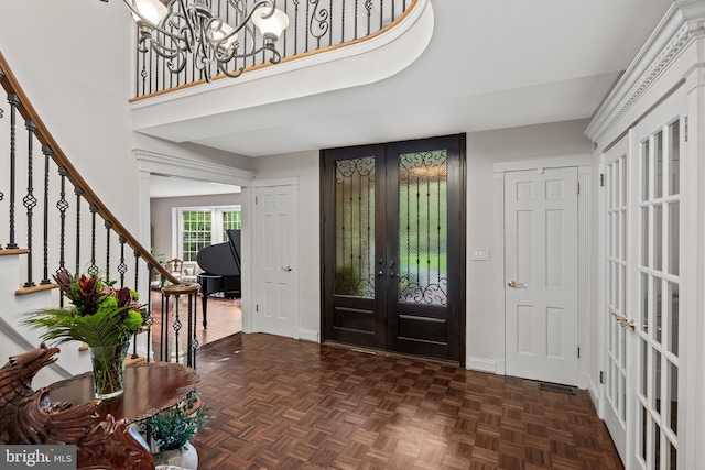 21 Robin Rd, Moorestown, NJ 08057 - foyer entrance featuring french doors, stairs, baseboards, a chandelier, and a towering ceiling