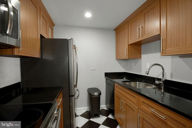 kitchen featuring dishwasher, a sink, stainless steel microwave, recessed lighting, and tile patterned floors