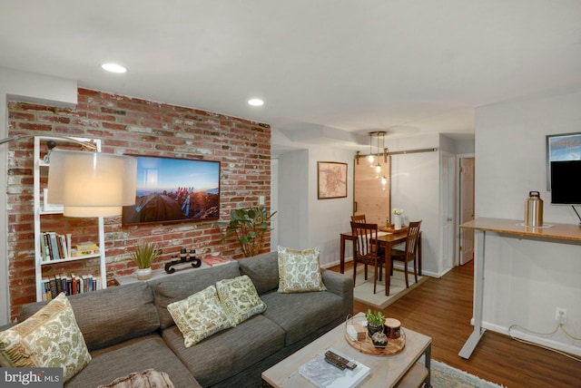 living room featuring recessed lighting, baseboards, and wood finished floors