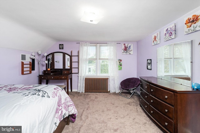 bedroom with light carpet, radiator, lofted ceiling, and visible vents