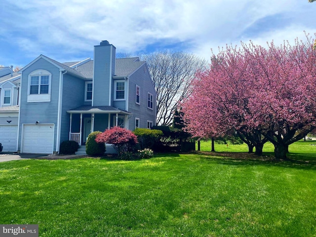 97 Kirkwood Dr, Newtown, PA 18940 - view of property exterior featuring a chimney, a lawn, aphalt driveway, a garage, and roof with shingles
